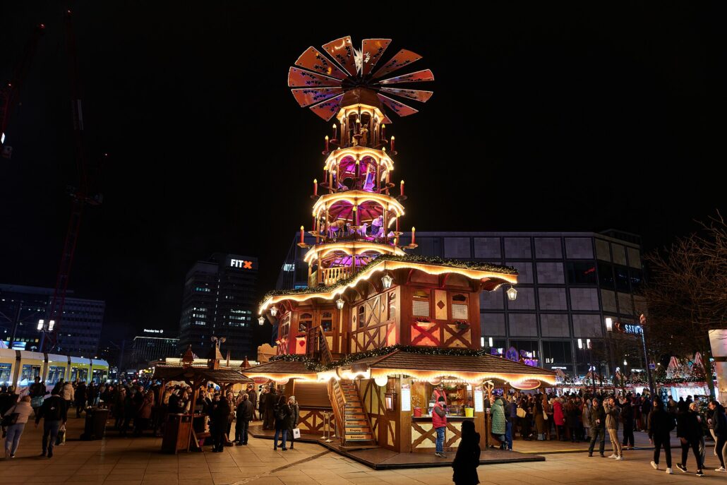 Christmas market in Alexanderplatz in Berlin during winter, evening.
